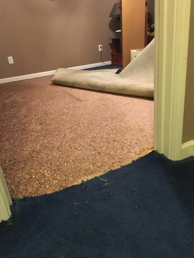 Carpet pad removal revealing water damage during Drying & Dehumidification in Post Falls